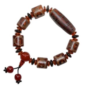 Explorez la culture tibétaine avec le bracelet dzi tibétain de la Boutique Zen Himalayan-eshop. Bracelet artisanal unique, combinant agates à 9 & 3 yeux et perle d'agate orange pour attirer la richesse et le bonheur. Commandez dès maintenant votre bijou authentique de l'Himalaya !