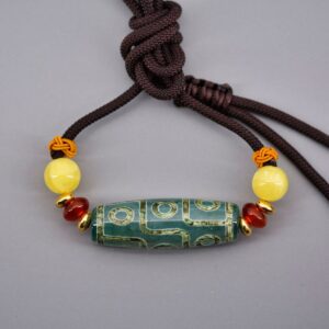 Pendentif chung dzi artisanat ethnique Tibet Chine