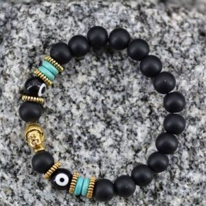 Bracelet en pierre de Lave mate | Bouddha & Dzi de verre à 2 yeux. Découvrez ce bracelet en pierre de lave mate et dzi tibétain de verre à deux yeux.