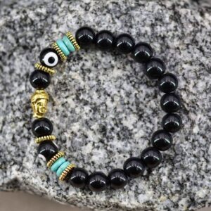 Bracelet en Onyx noir | Bouddha & Dzi de verre à 2 yeux. Découvrez ce bracelet en onyx noir et dzi tibétain de verre à deux yeux.